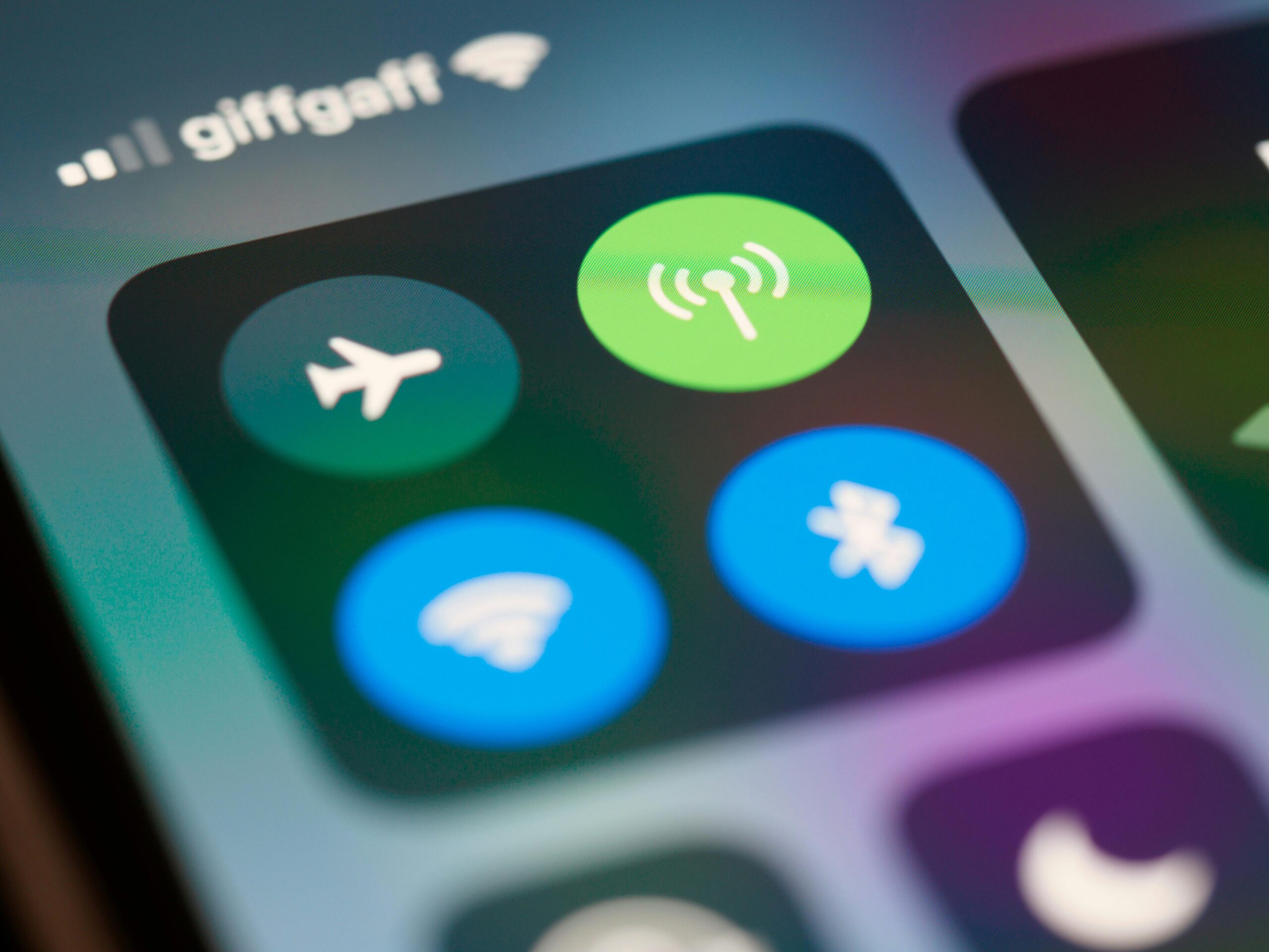 High-resolution close-up of smartphone interface showing control center icons.